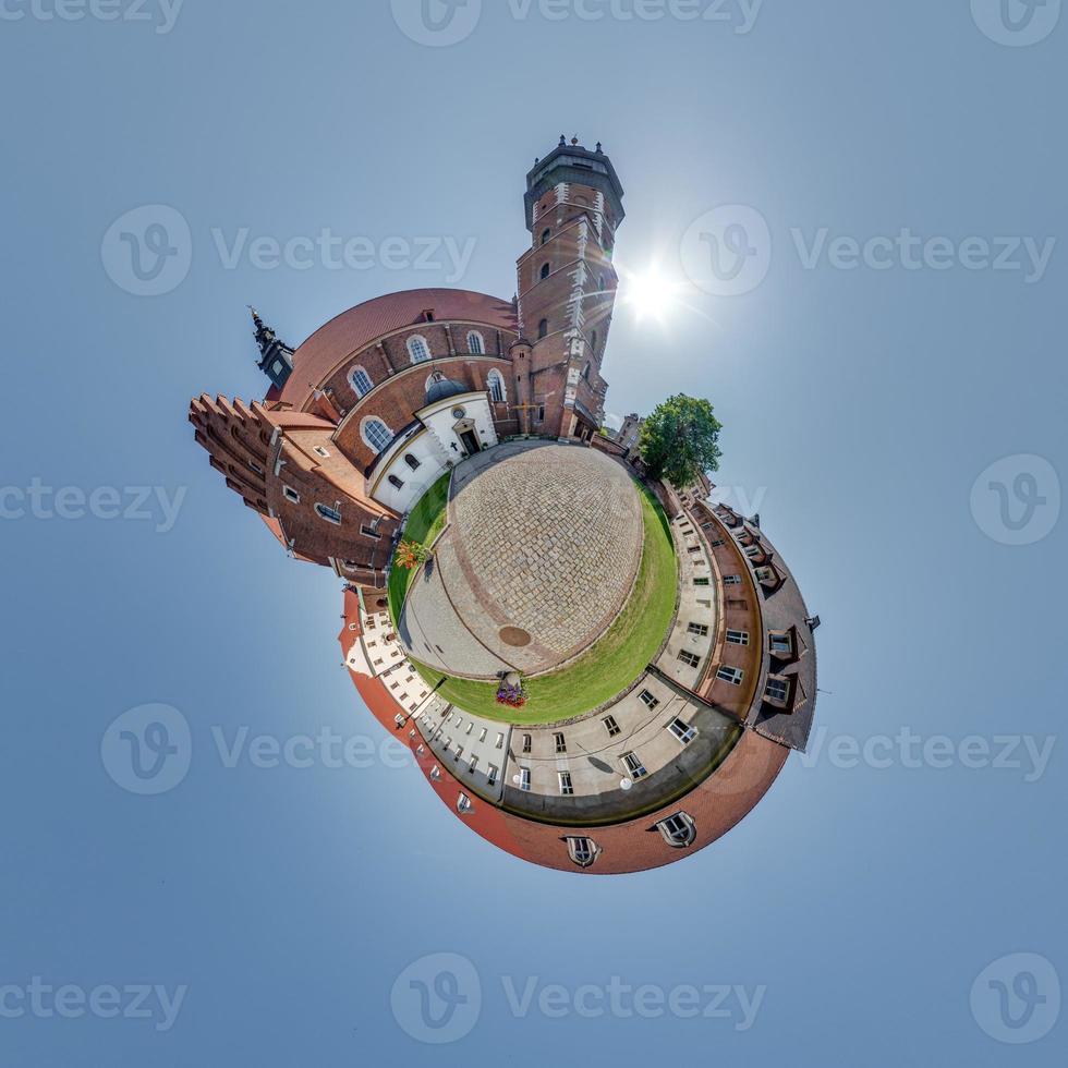 Little planet and spherical aerial 360 panorama view on street ancient medieval city with church and historic buildings photo