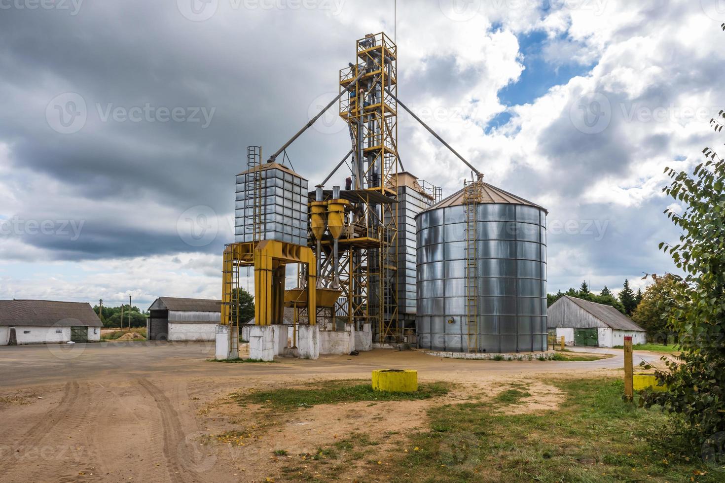 agro silos granary elevator with seeds cleaning line on agro-processing manufacturing plant for processing drying cleaning and storage of agricultural products photo