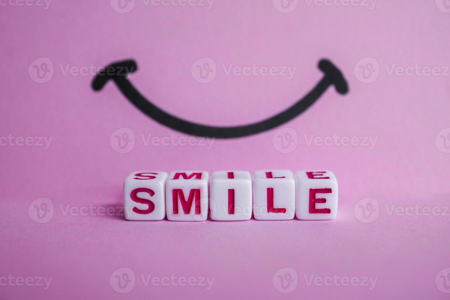 smile word with red cube letters, feelings and emotions photo