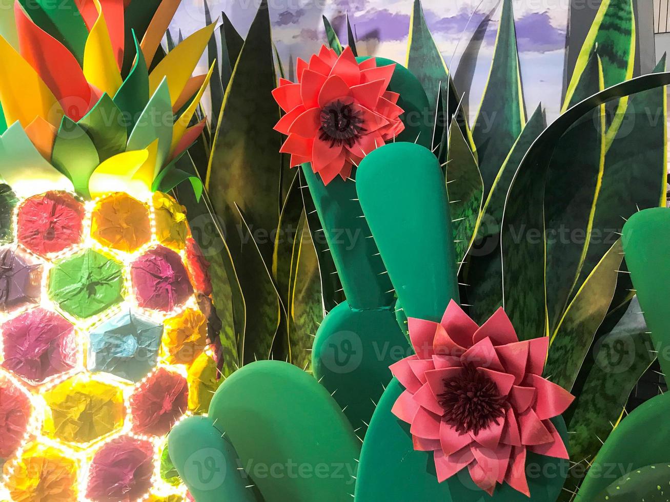 Abstract plastic artificial green shiny glowing cheerful beautiful joyful Mexican cacti with flowers. The background photo