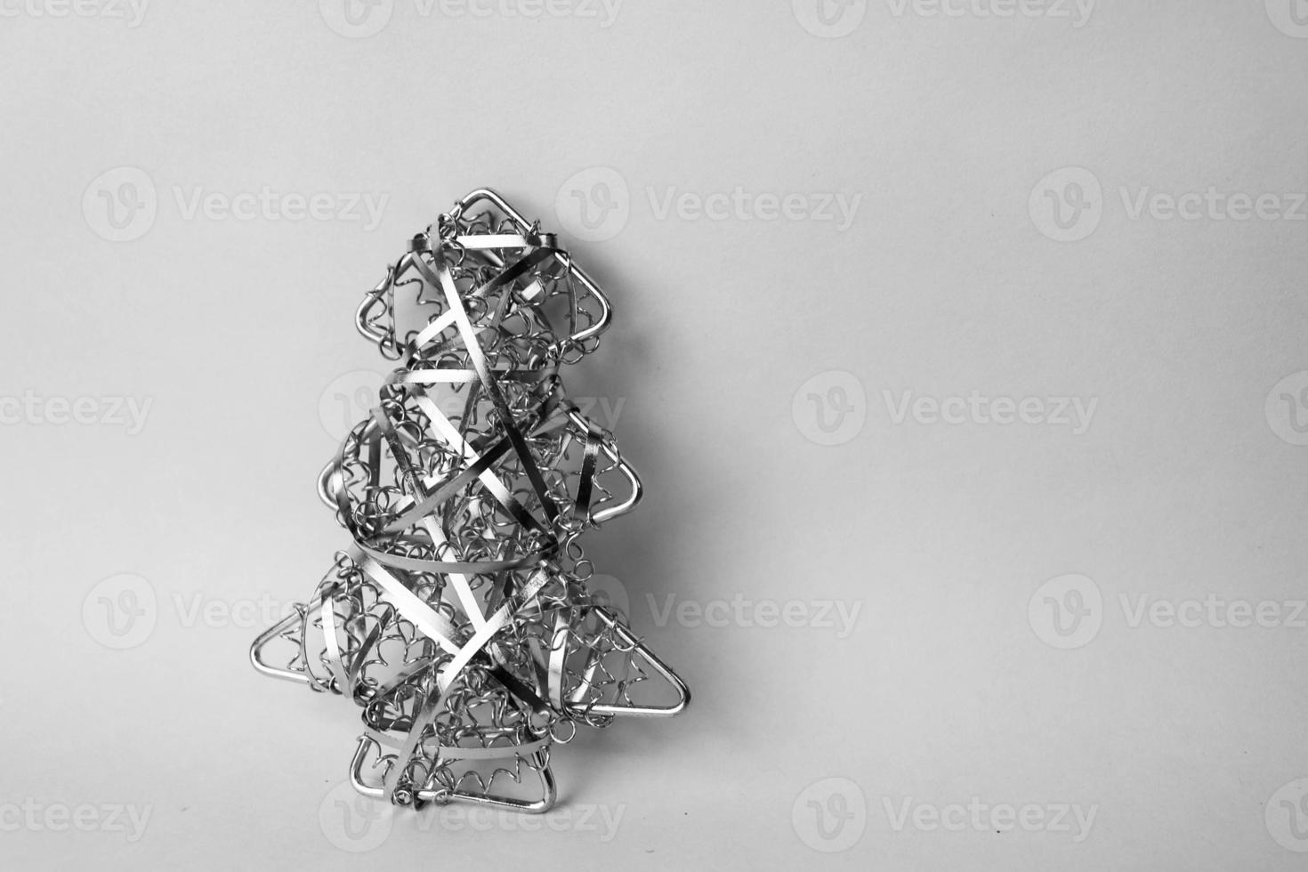 Festive Christmas Christmas happy blue-pink joyful background with a small toy metal iron golden homemade Christmas tree. Holiday decorations photo