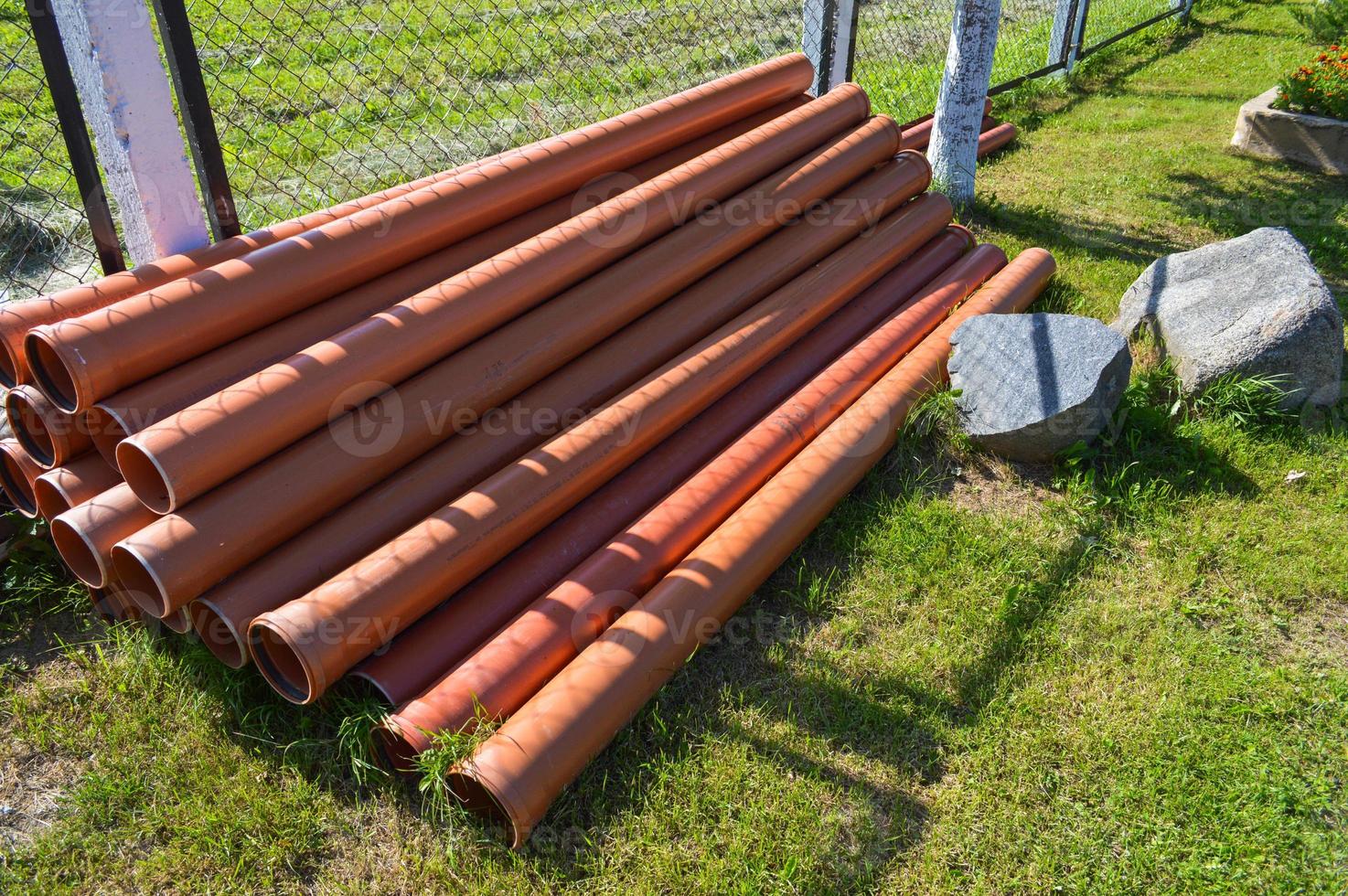 Orange plastic industrial polypropylene thick plumbing pipes with large diameter gaskets with flanges photo