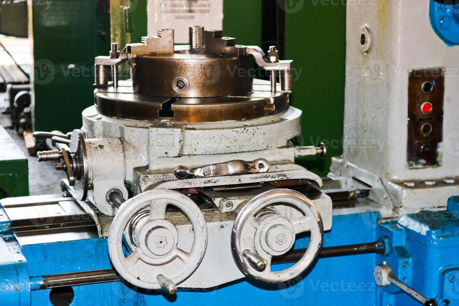Industrial iron lathe for cutting, turning of billets from metals, wood and other materials, turning, manufacturing of details and spare parts at the factory photo