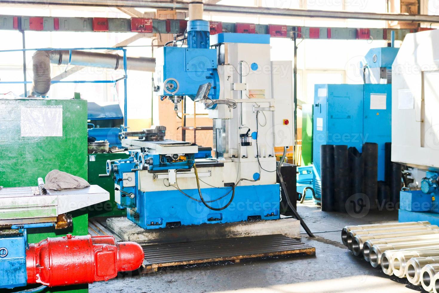 Industrial iron lathe for cutting, turning of billets from metals, wood and other materials, turning, manufacturing of details and spare parts at the factory photo