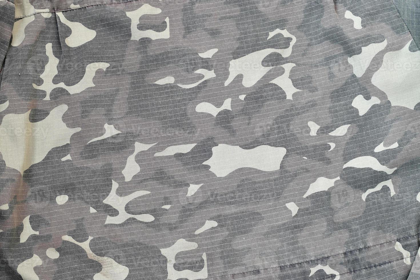 Camouflage background texture as backdrop for paintball and airsoft strikeball design projects photo