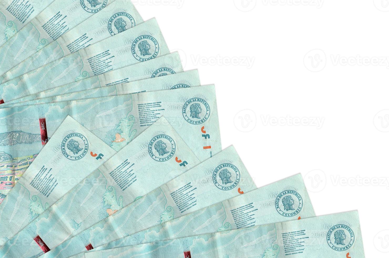 2 Colombian pesos bills lies isolated on white background with copy space stacked in fan close up photo