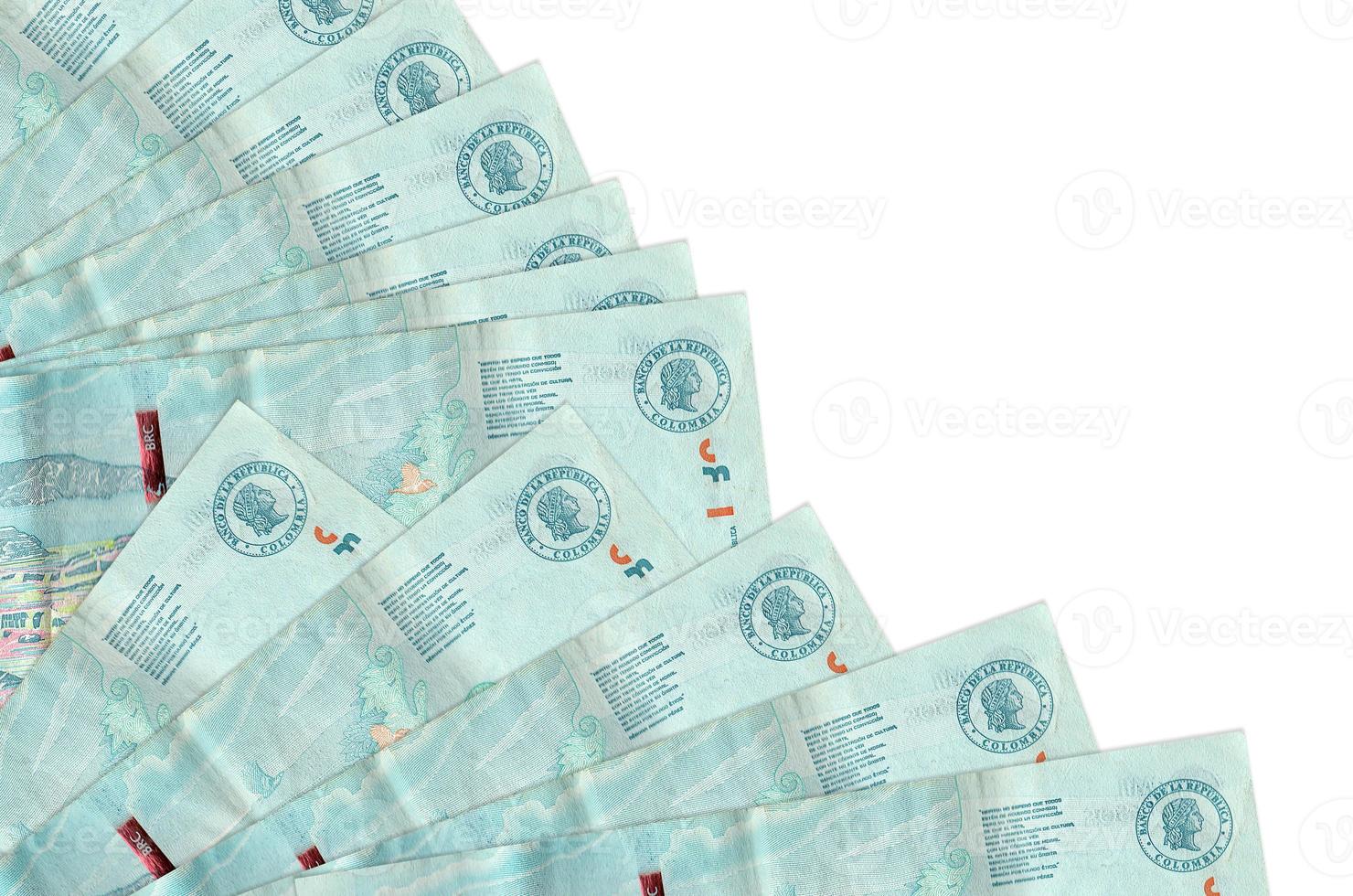 2 Colombian pesos bills lies isolated on white background with copy space stacked in fan close up photo