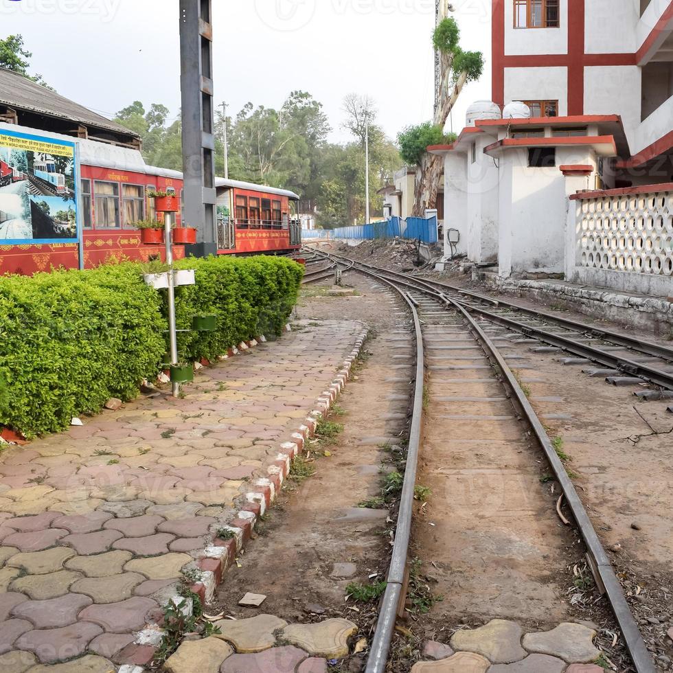 View of Toy train Railway Tracks from the middle during daytime near Kalka railway station in India, Toy train track view, Indian Railway junction, Heavy industry photo