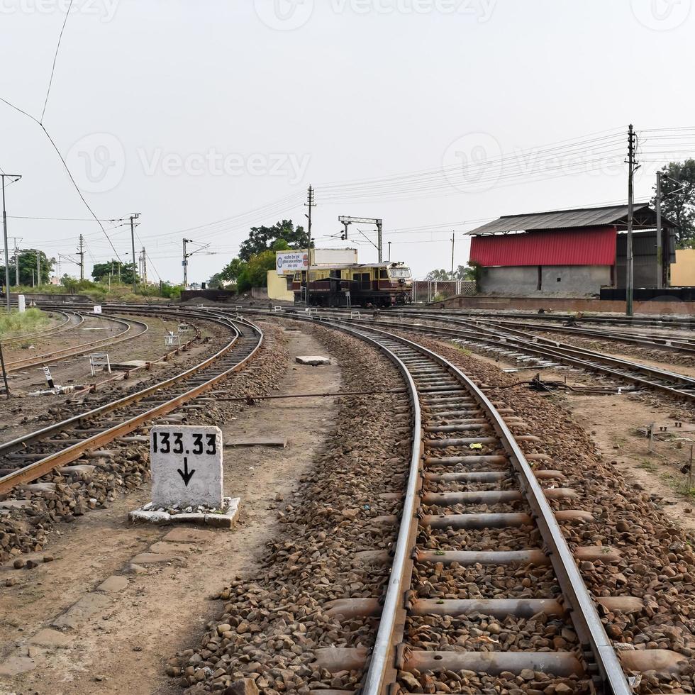 View of Toy train Railway Tracks from the middle during daytime near Kalka railway station in India, Toy train track view, Indian Railway junction, Heavy industry photo