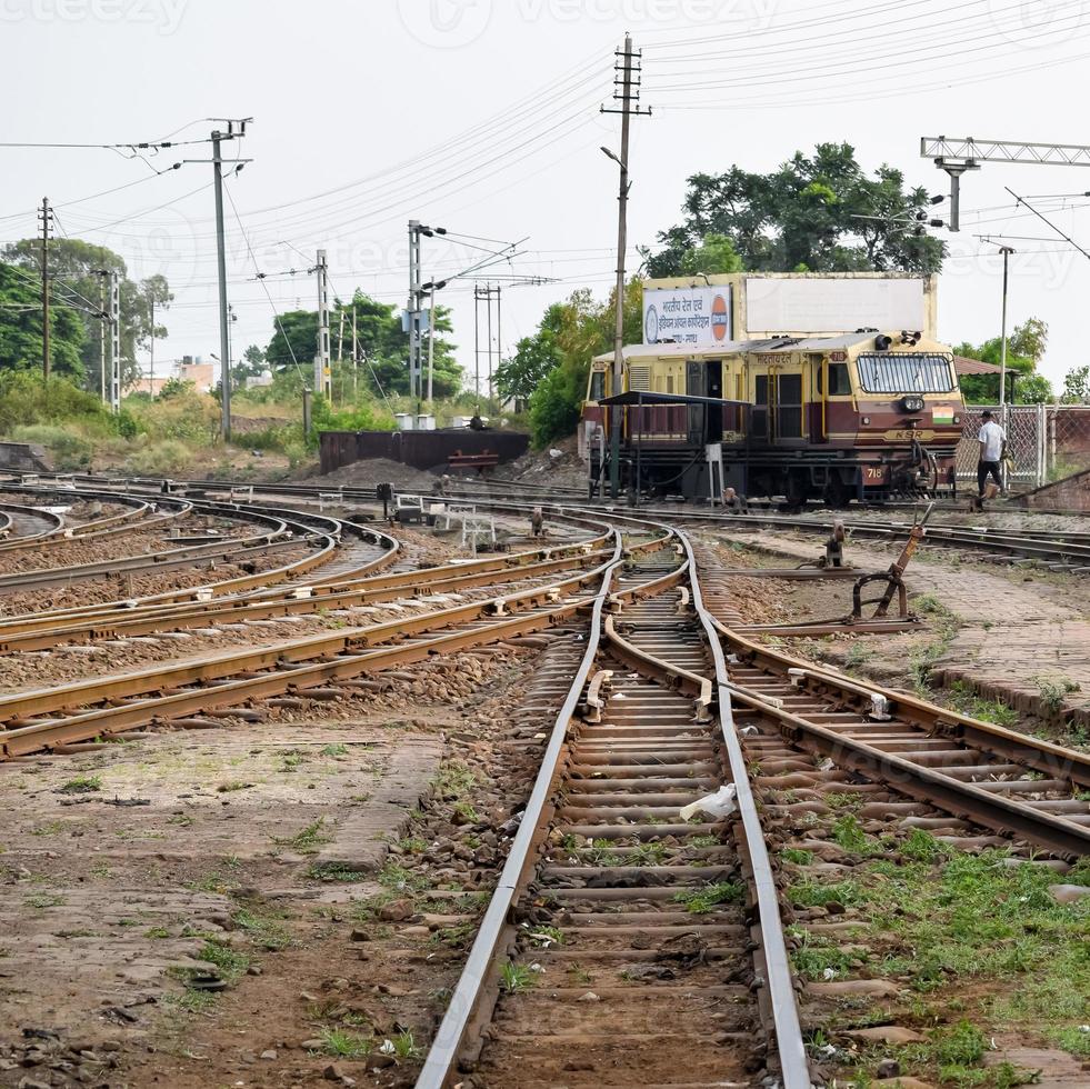 View of Toy train Railway Tracks from the middle during daytime near Kalka railway station in India, Toy train track view, Indian Railway junction, Heavy industry photo