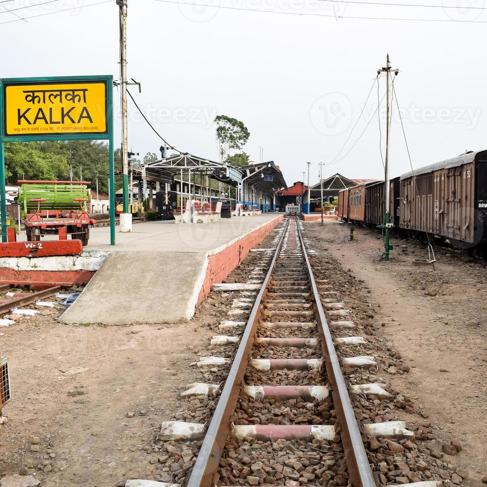 View of Toy train Railway Tracks from the middle during daytime near Kalka railway station in India, Toy train track view, Indian Railway junction, Heavy industry photo