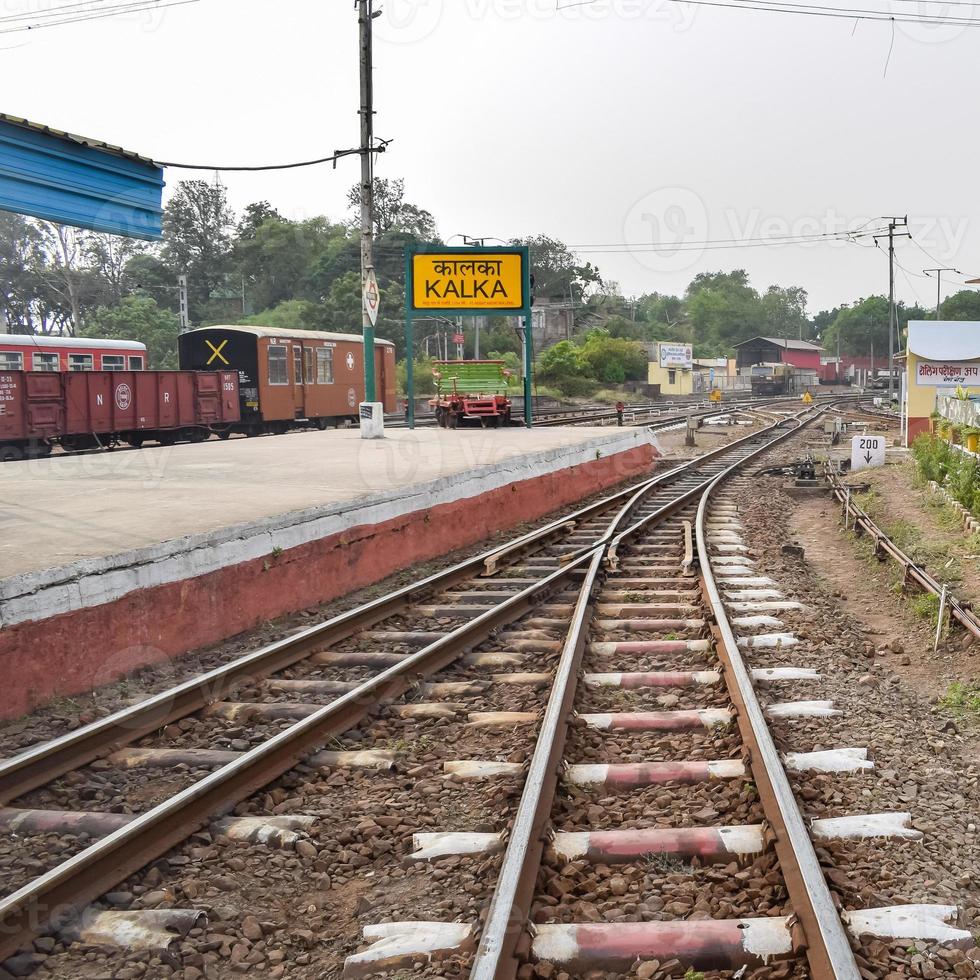 View of Toy train Railway Tracks from the middle during daytime near Kalka railway station in India, Toy train track view, Indian Railway junction, Heavy industry photo