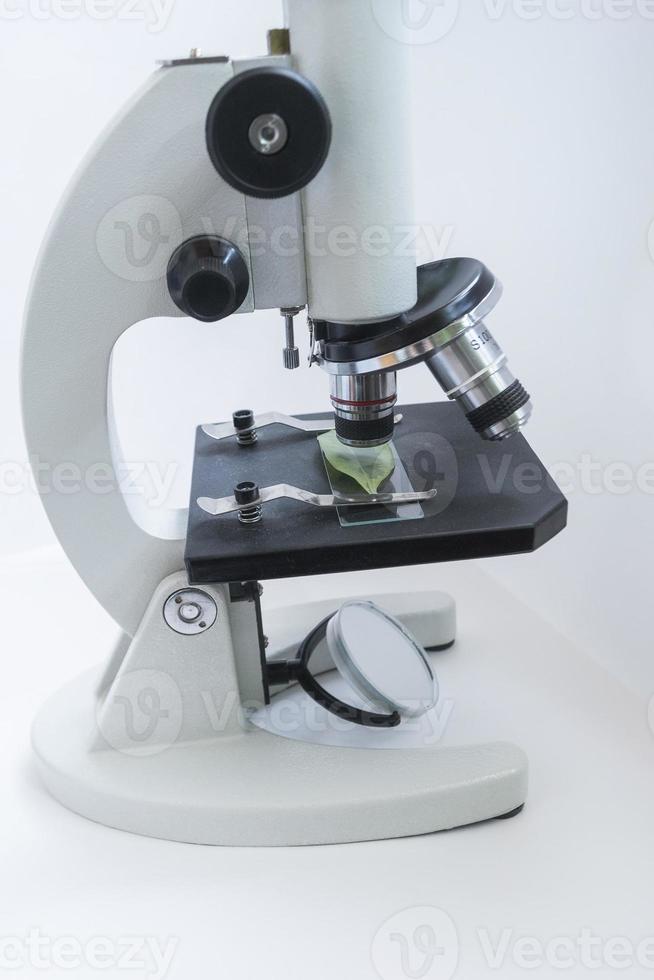 Closeup lens of a modern microscope in a research lab. Selective focus photo