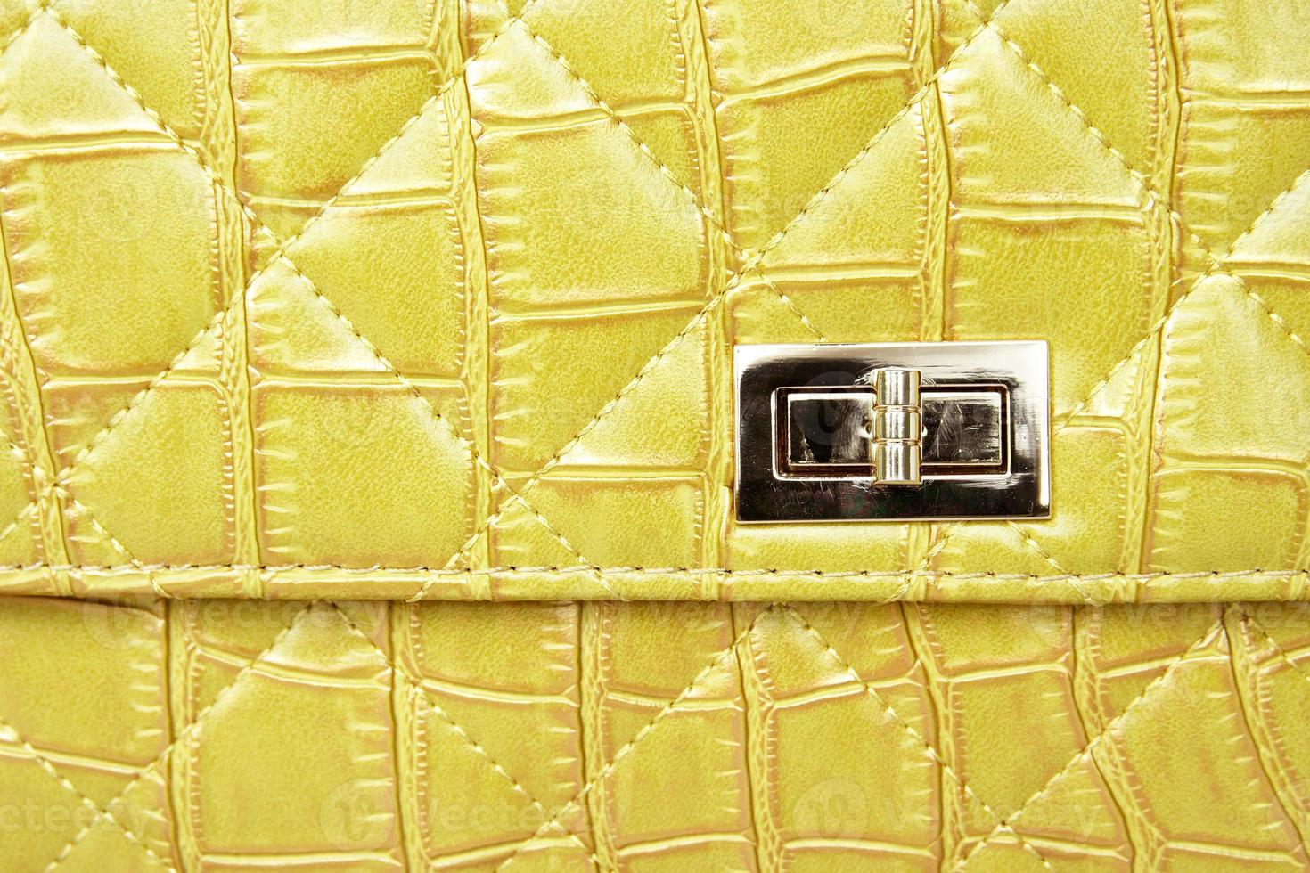 Metal lock on leather bag photo