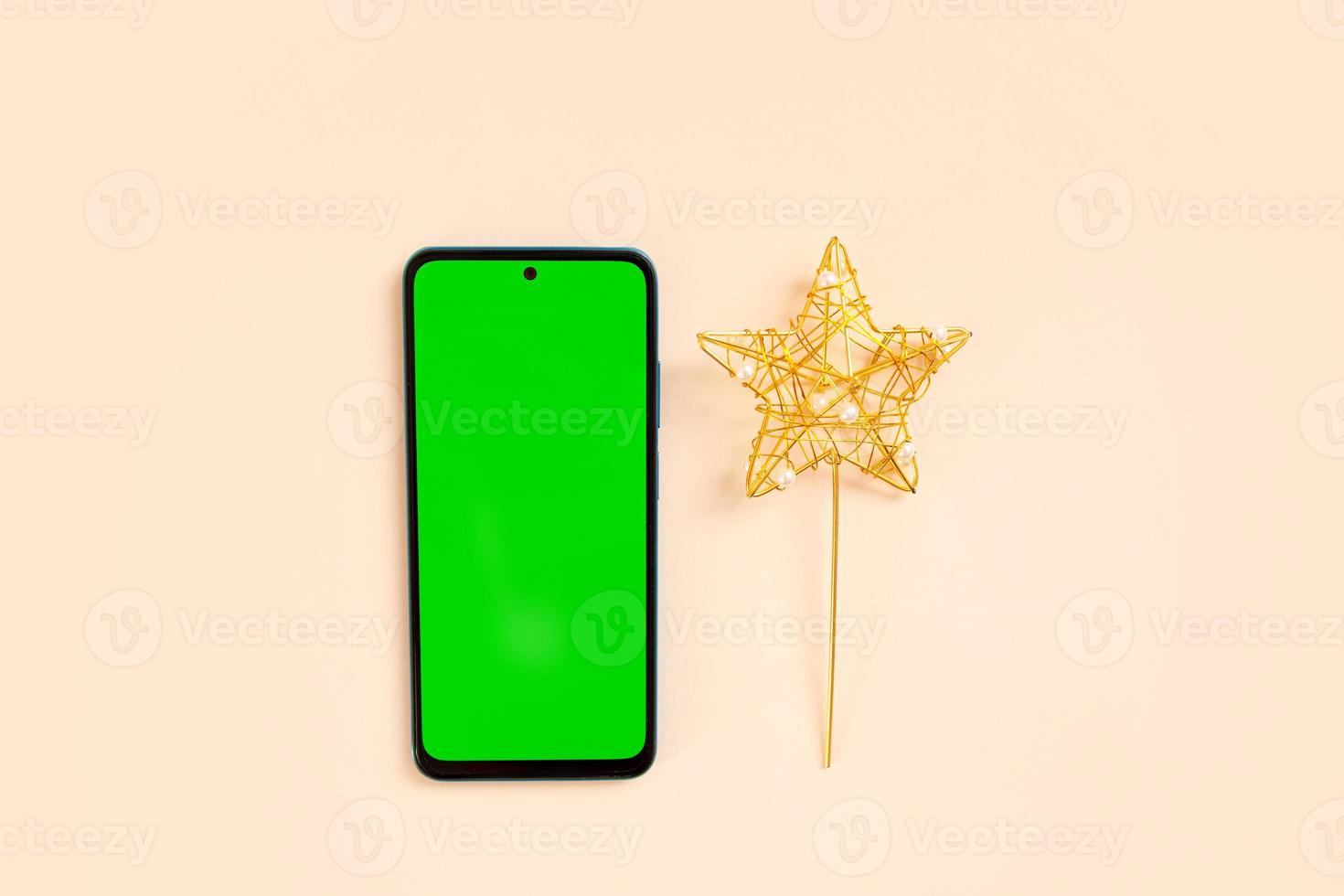 Chrismas flat lay with holiday decorations and phone  with green screen. Chroma key. photo