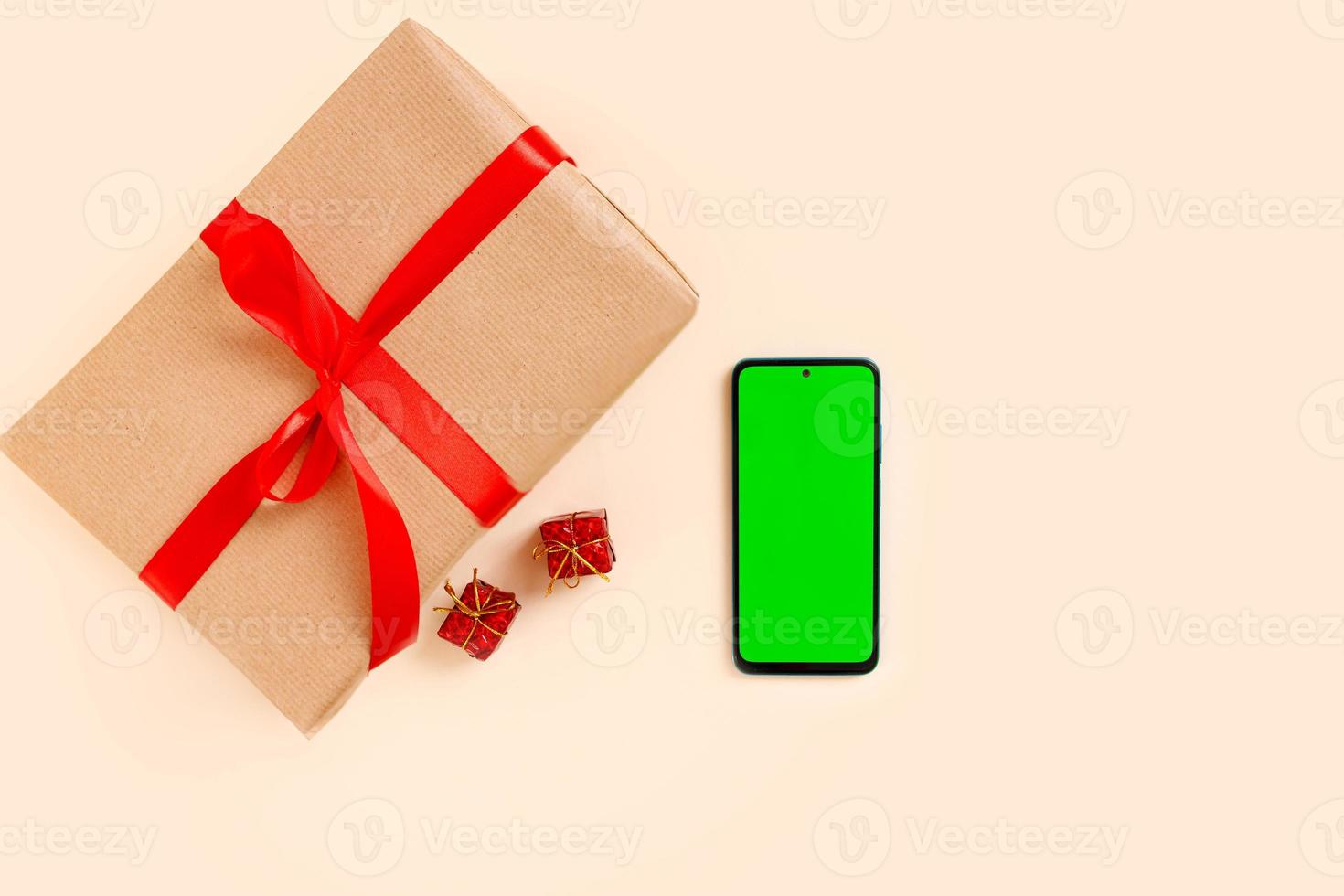 Chrismas flat lay with holiday decorations and phone  with green screen. Chroma key. photo