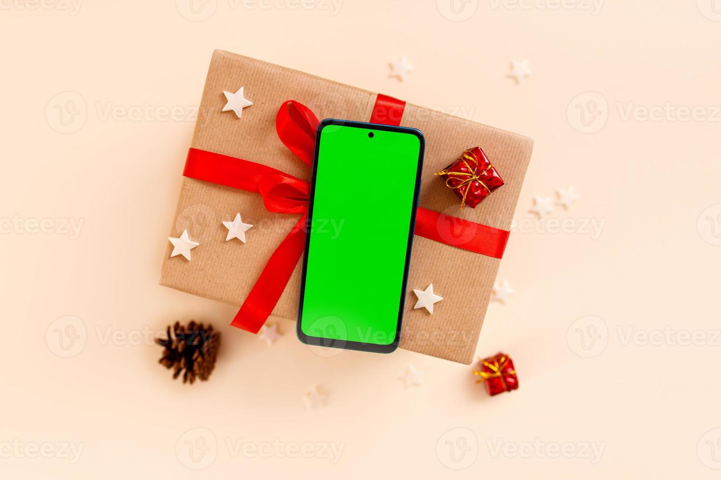 Chrismas flat lay with holiday decorations and phone  with green screen. Chroma key. photo
