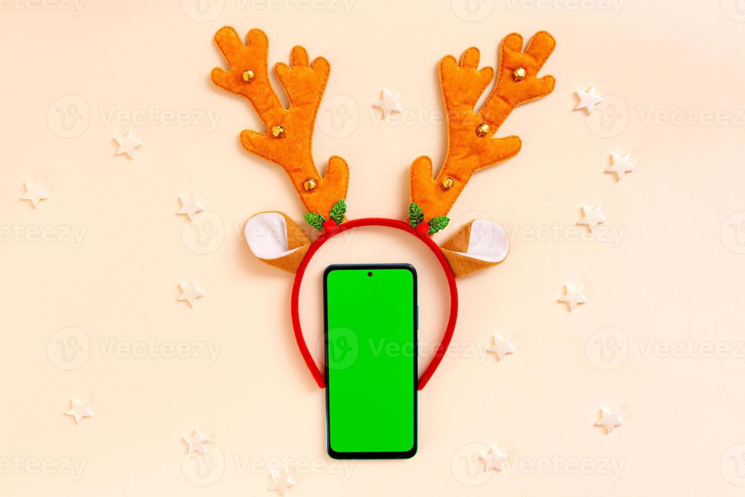 Chrismas flat lay with holiday decorations and phone  with green screen. Chroma key. photo