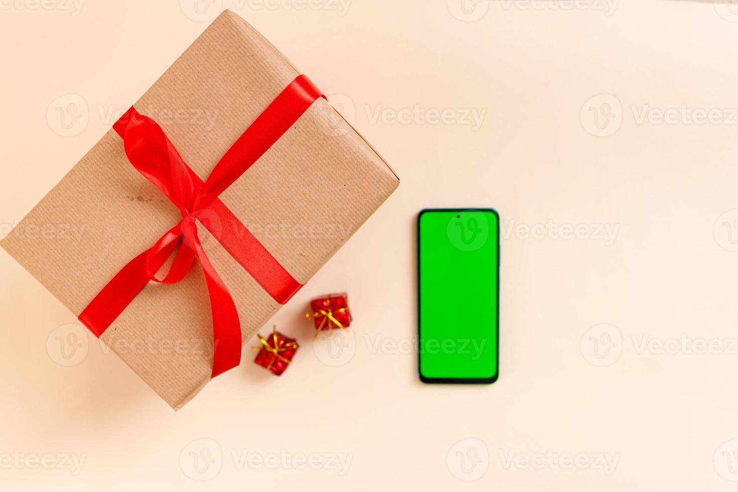 Chrismas flat lay with holiday decorations and phone  with green screen. Chroma key. photo