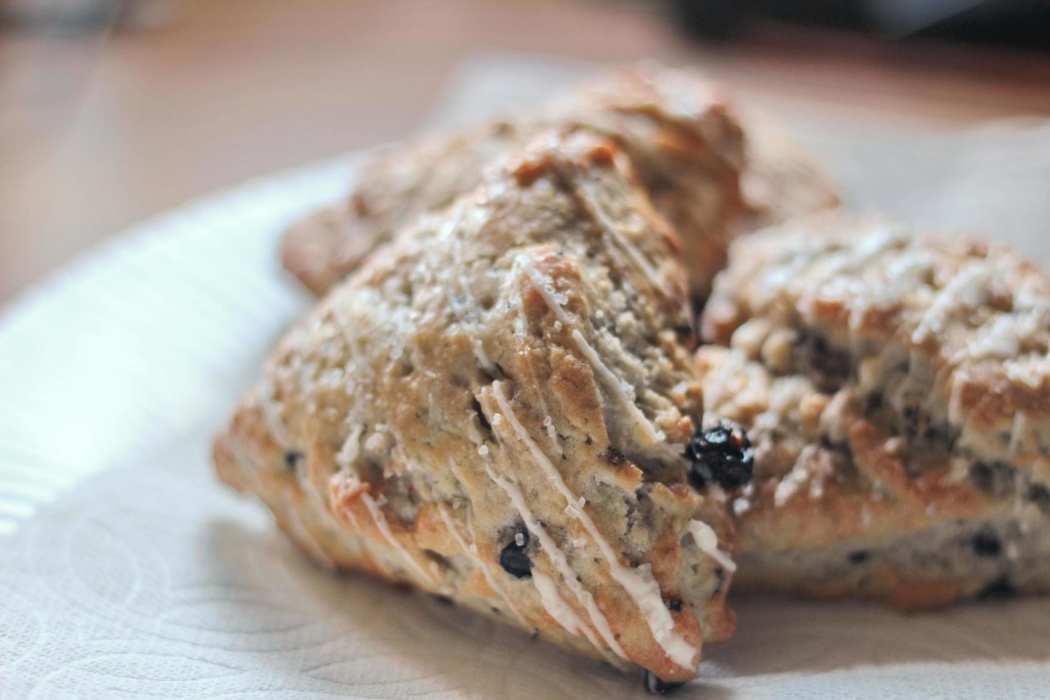 blue berry scones served in white plates photo
