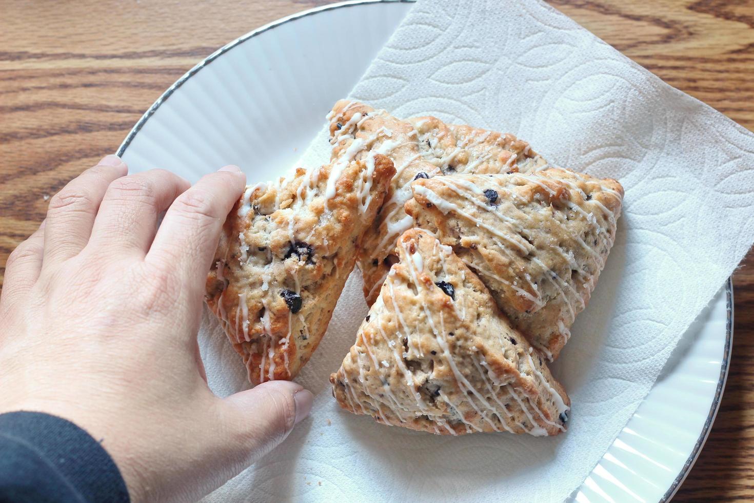 blue berry scones served in white plates photo