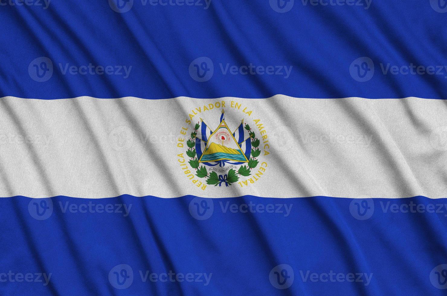 El Salvador flag  is depicted on a sports cloth fabric with many folds. Sport team banner photo