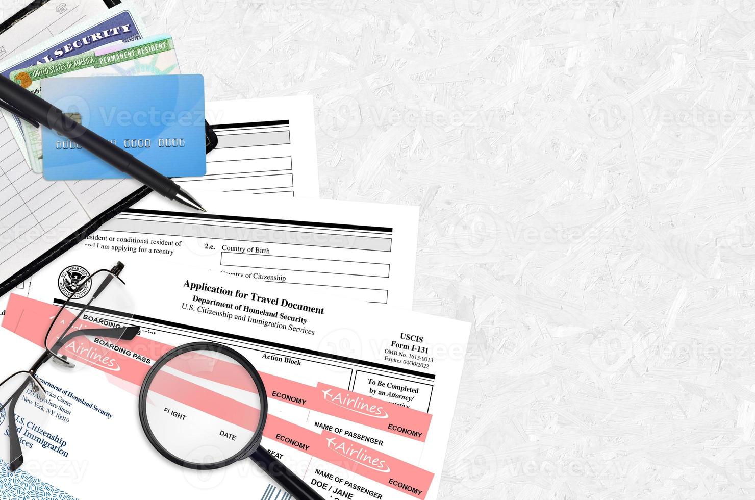 USCIS form I-131 Application for travel document lies on flat lay office table and ready to fill. U.S. Citizenship and Immigration services paperwork concept photo