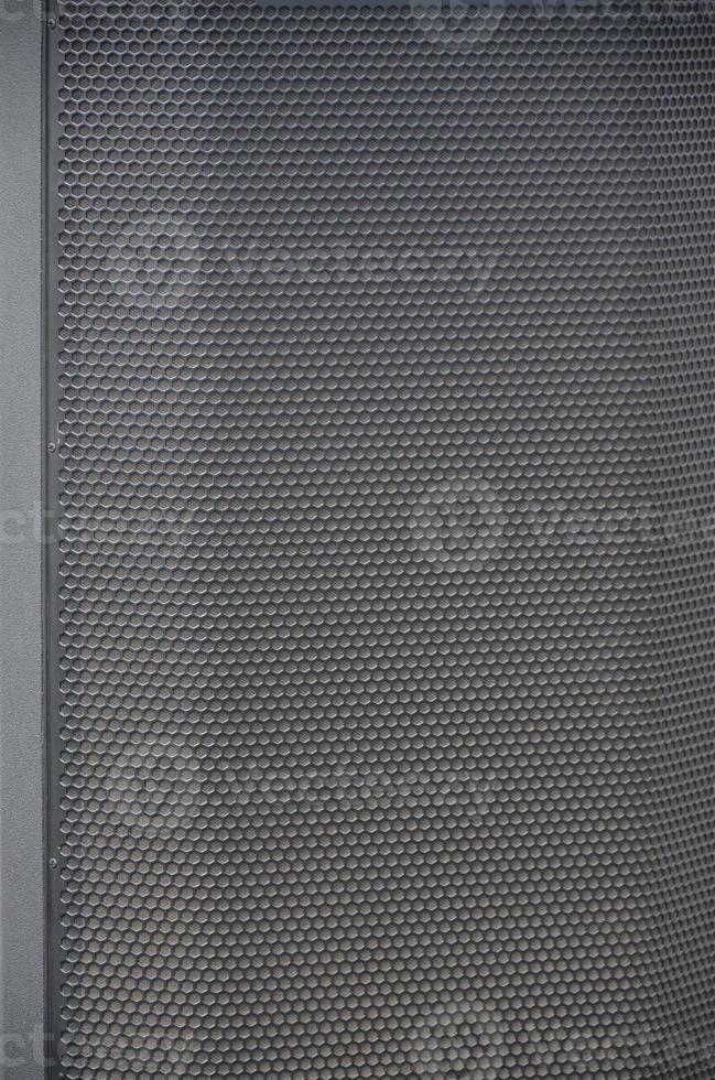 Abstract black metallic mesh texture pattern for Industrial background. Speaker of musical column and free space for text photo