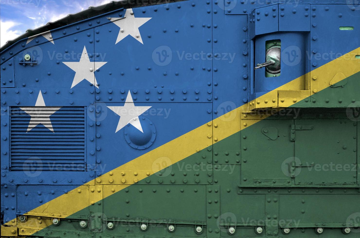 Solomon Islands flag depicted on side part of military armored tank closeup. Army forces conceptual background photo