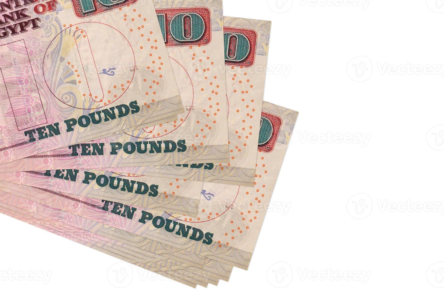 10 Egyptian pounds bills lies in small bunch or pack isolated on white. Mockup with copy space. Business and currency exchange photo