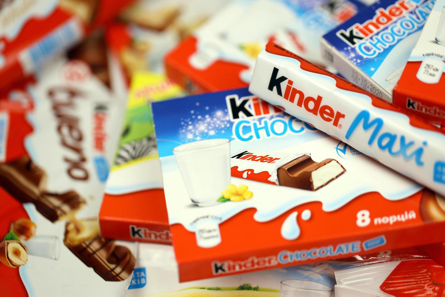 KHARKOV, UKRAINE - DECEMBER 8, 2020 Many different products by Kinder brand made by Ferrero SpA. Kinder is a confectionery product brand line of Italian manufacturer Ferrero photo