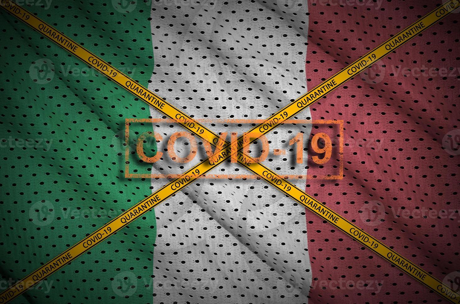 Italy flag and Covid-19 stamp with orange quarantine border tape cross. Coronavirus or 2019-nCov virus concept photo