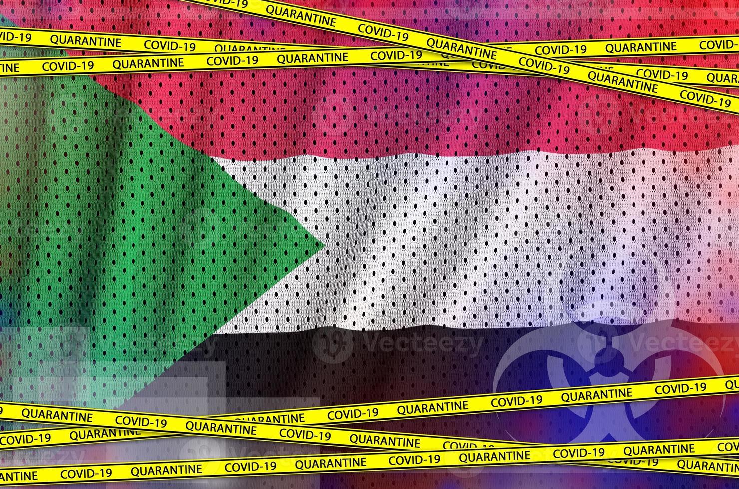 Sudan flag and Covid-19 quarantine yellow tape. Coronavirus or 2019-nCov virus concept photo