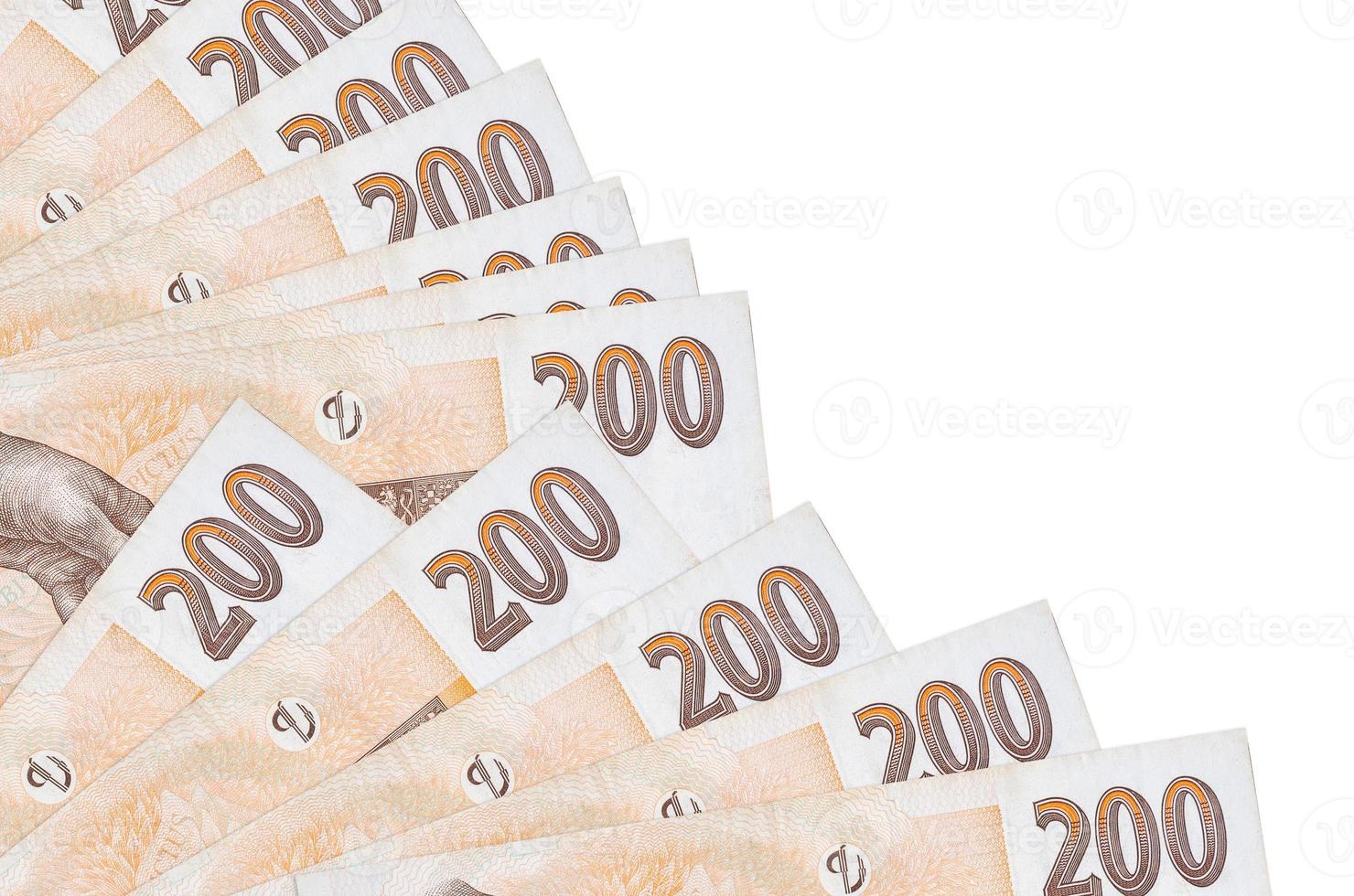200 Czech korun bills lies isolated on white background with copy space stacked in fan close up photo