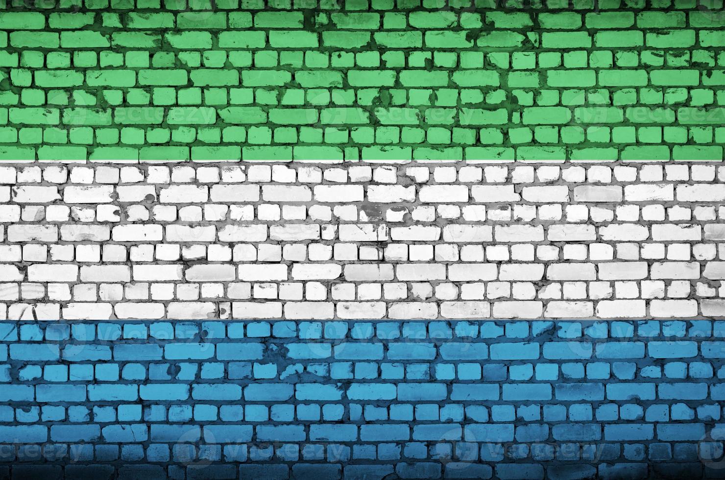 Sierra Leone flag is painted onto an old brick wall photo