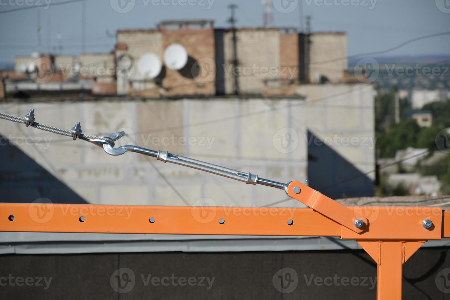 Rope lockers in rear beam of suspended wire rope platform for facade works on high multistorey buildings. Rope lockers blocks kink for safety platform usage photo