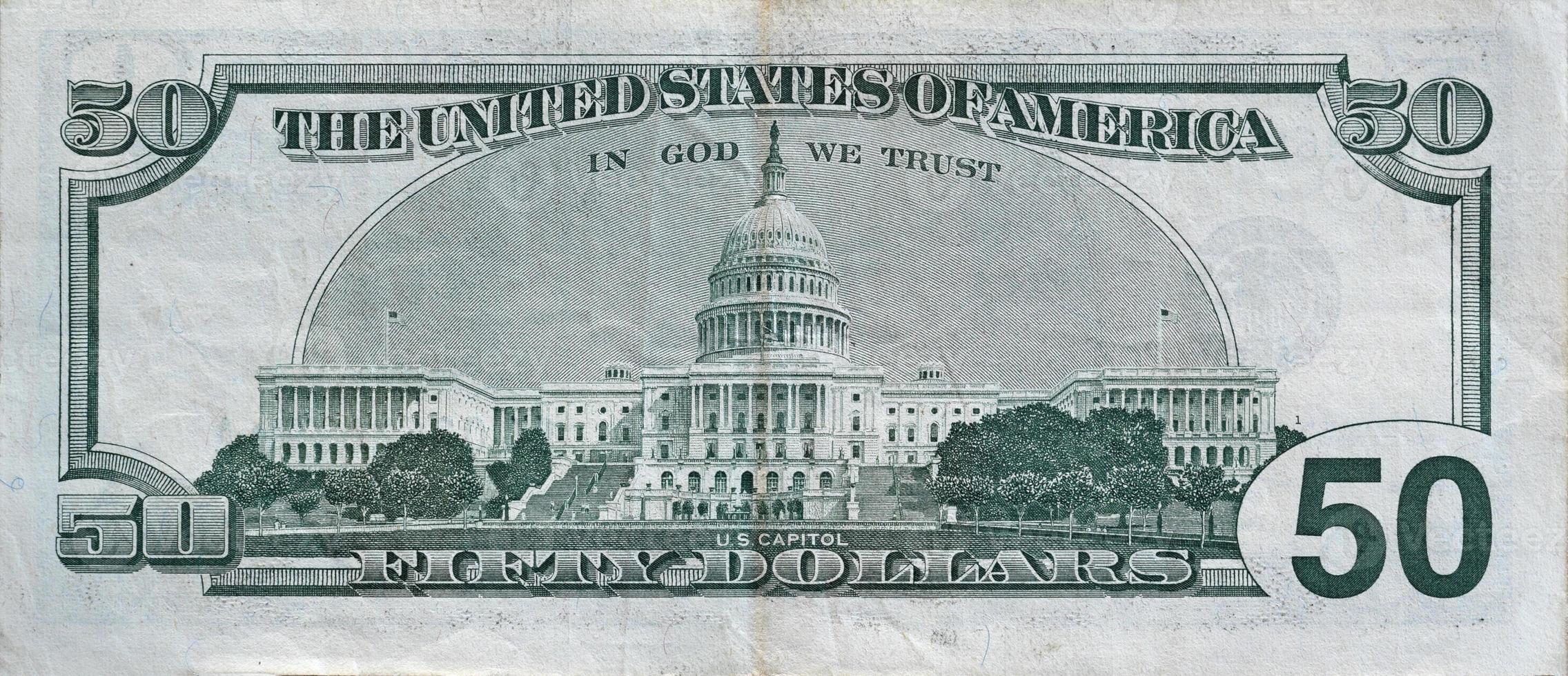US Capitol on 50 dollars banknote back side closeup macro fragment. United states fifty dollars money bill photo
