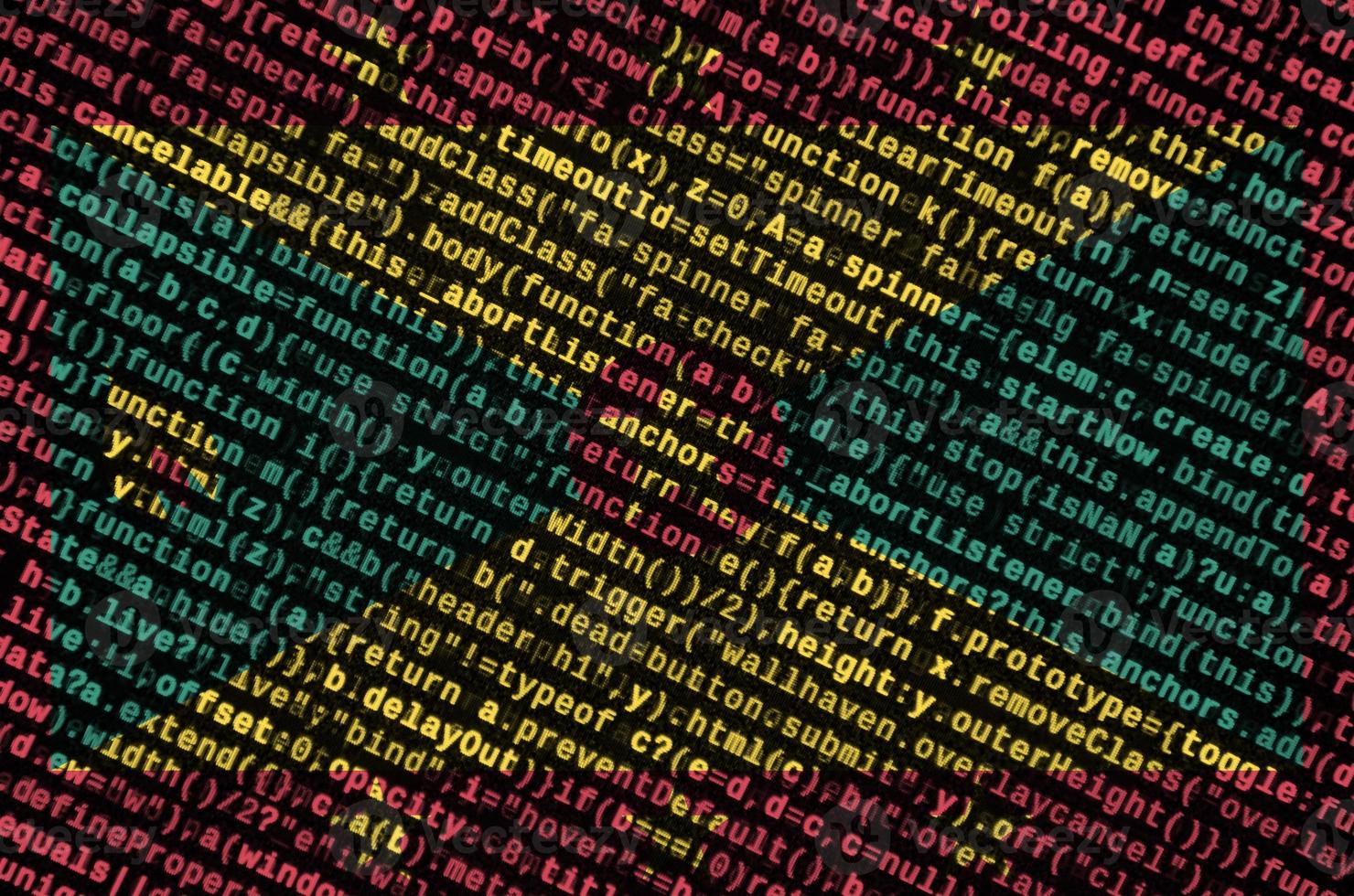 Grenada flag  is depicted on the screen with the program code. The concept of modern technology and site development photo