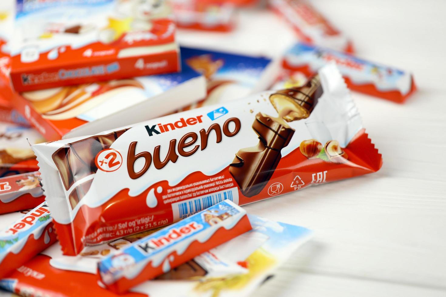 KHARKIV, UKRAINE - MAY 02, 2021 Many different products by Kinder brand made by Ferrero SpA. Kinder is a confectionery product brand line of Italian multinational manufacturer Ferrero photo