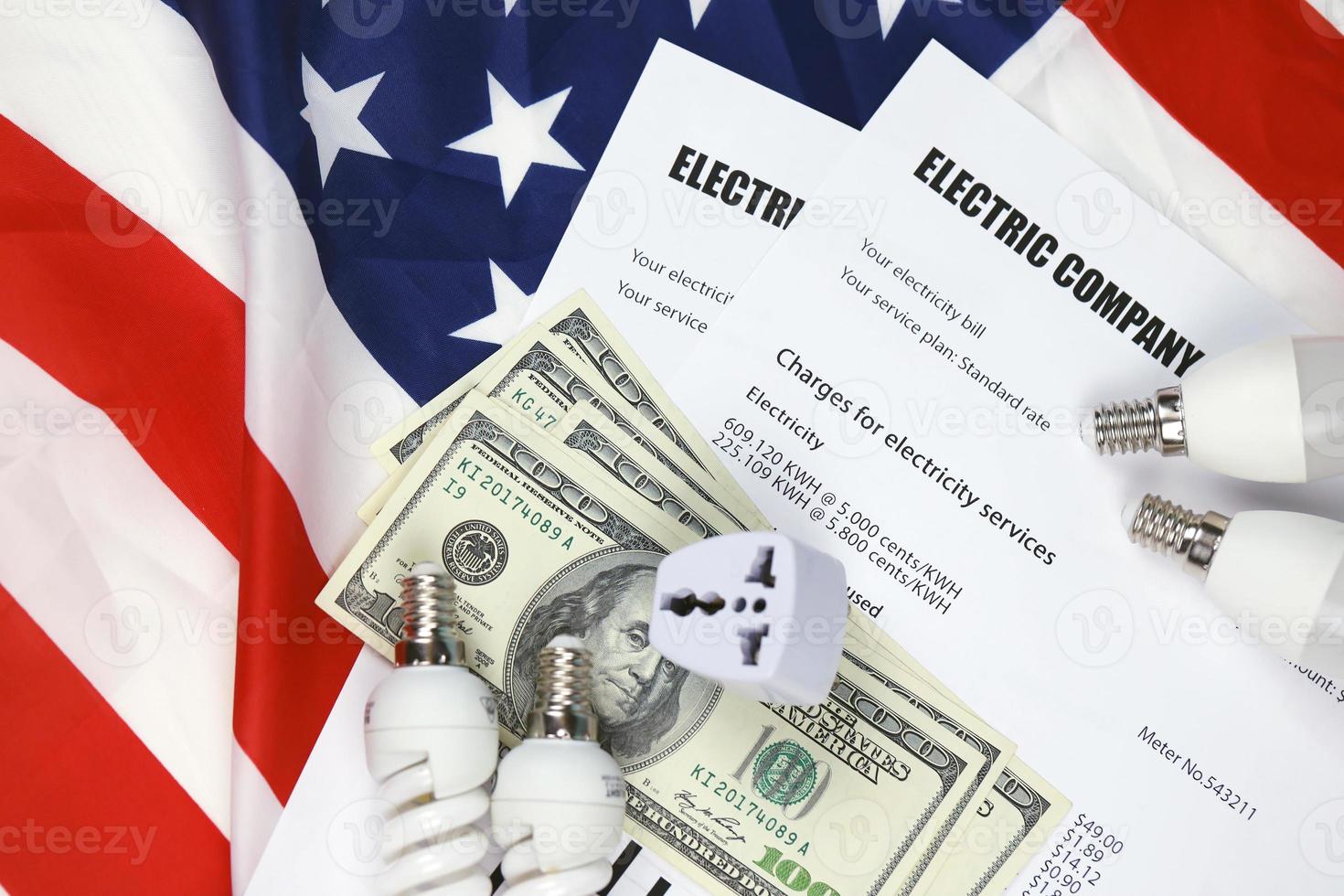 Abstract American electricity bill. Concept of saving money by using energy savings led light bulbs and electric bill payment photo