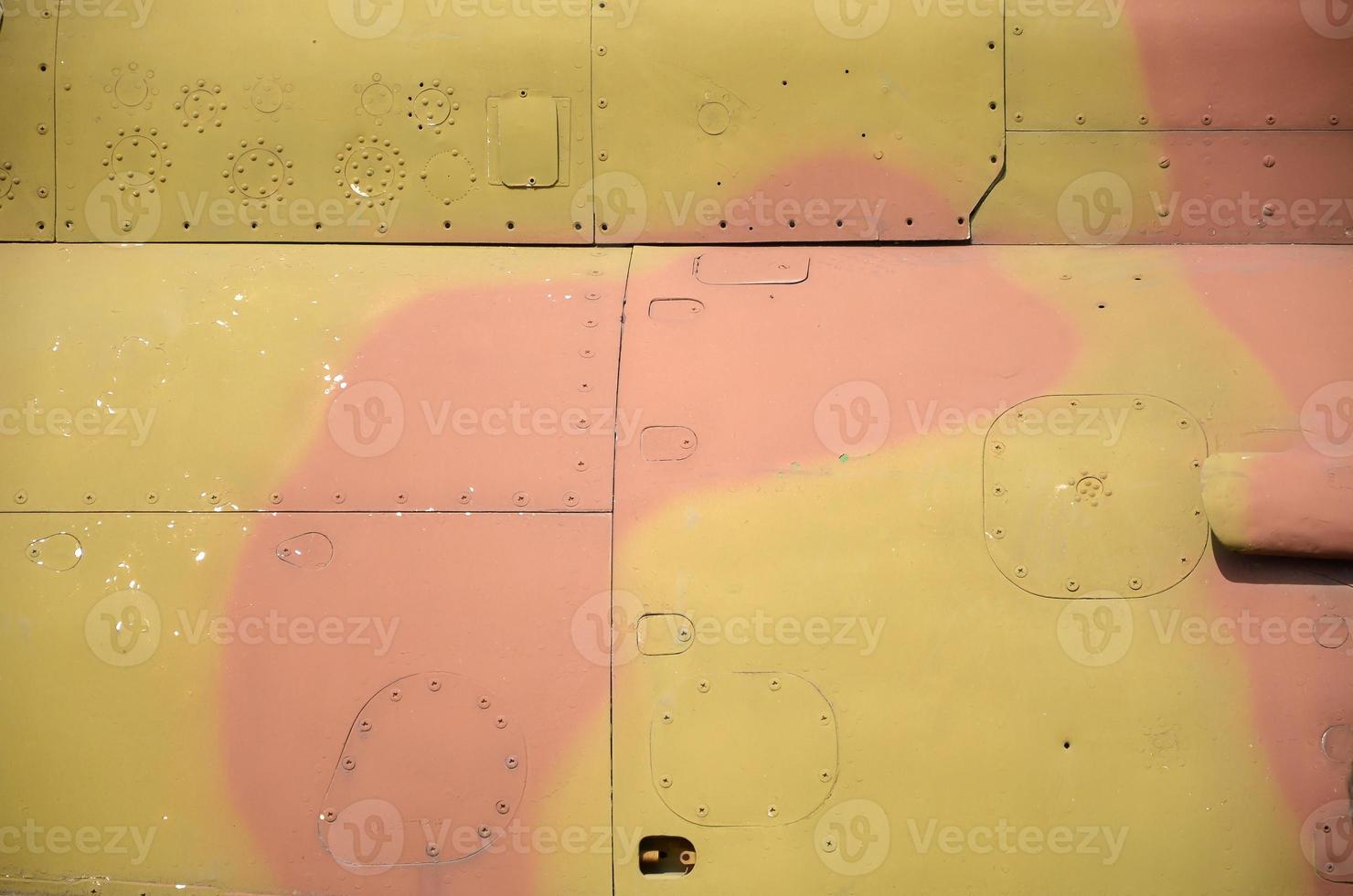 Dirty detailed texture of old fighter aircraft body painted in camouflage with many rivets photo