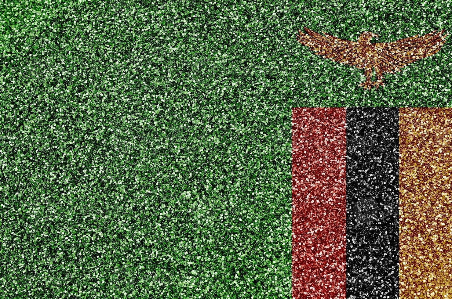 Zambia flag depicted on many small shiny sequins. Colorful festival background for party photo