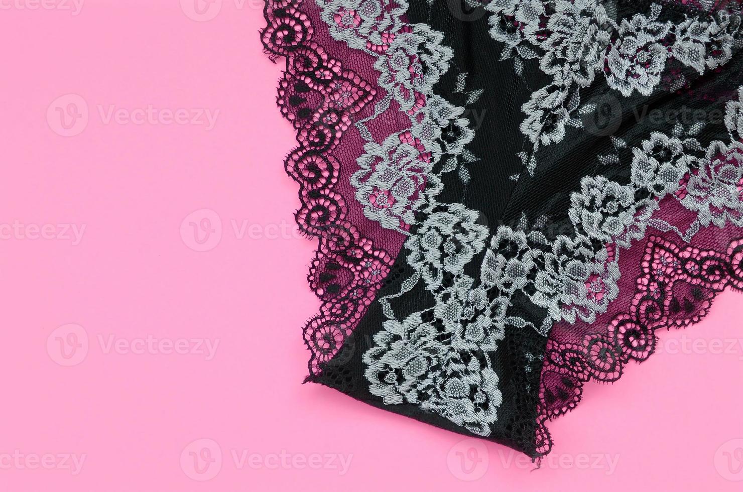 Black women underwear with lace on pink background with copy space. Beauty fashion blogger concept. Romantic lingerie for Valentines day temptation photo