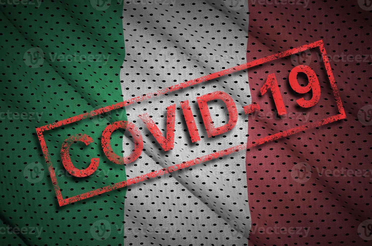 Italy flag and red Covid-19 stamp. Coronavirus 2019-nCov outbreak photo