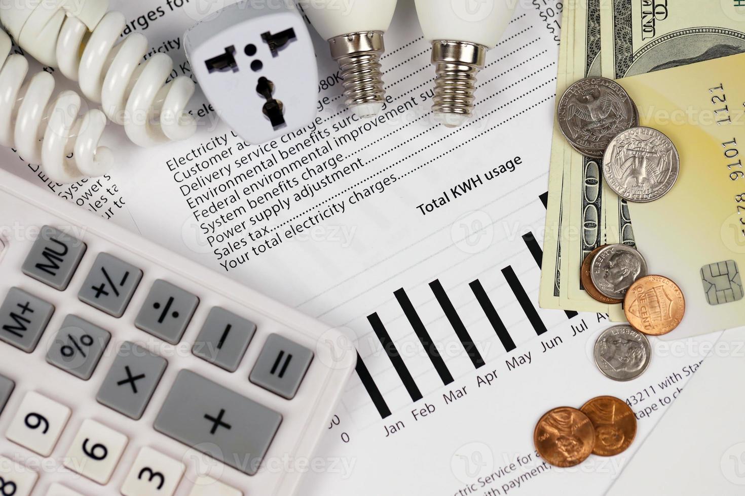 Abstract American electricity bill. Concept of saving money by using energy savings led light bulbs and electric bill payment photo