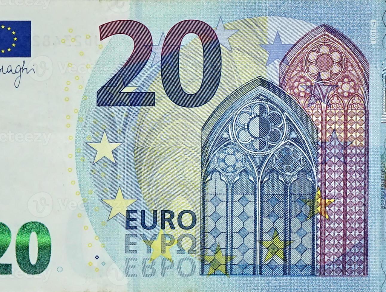 Fragment part of 20 euro banknote close-up with small blue details photo