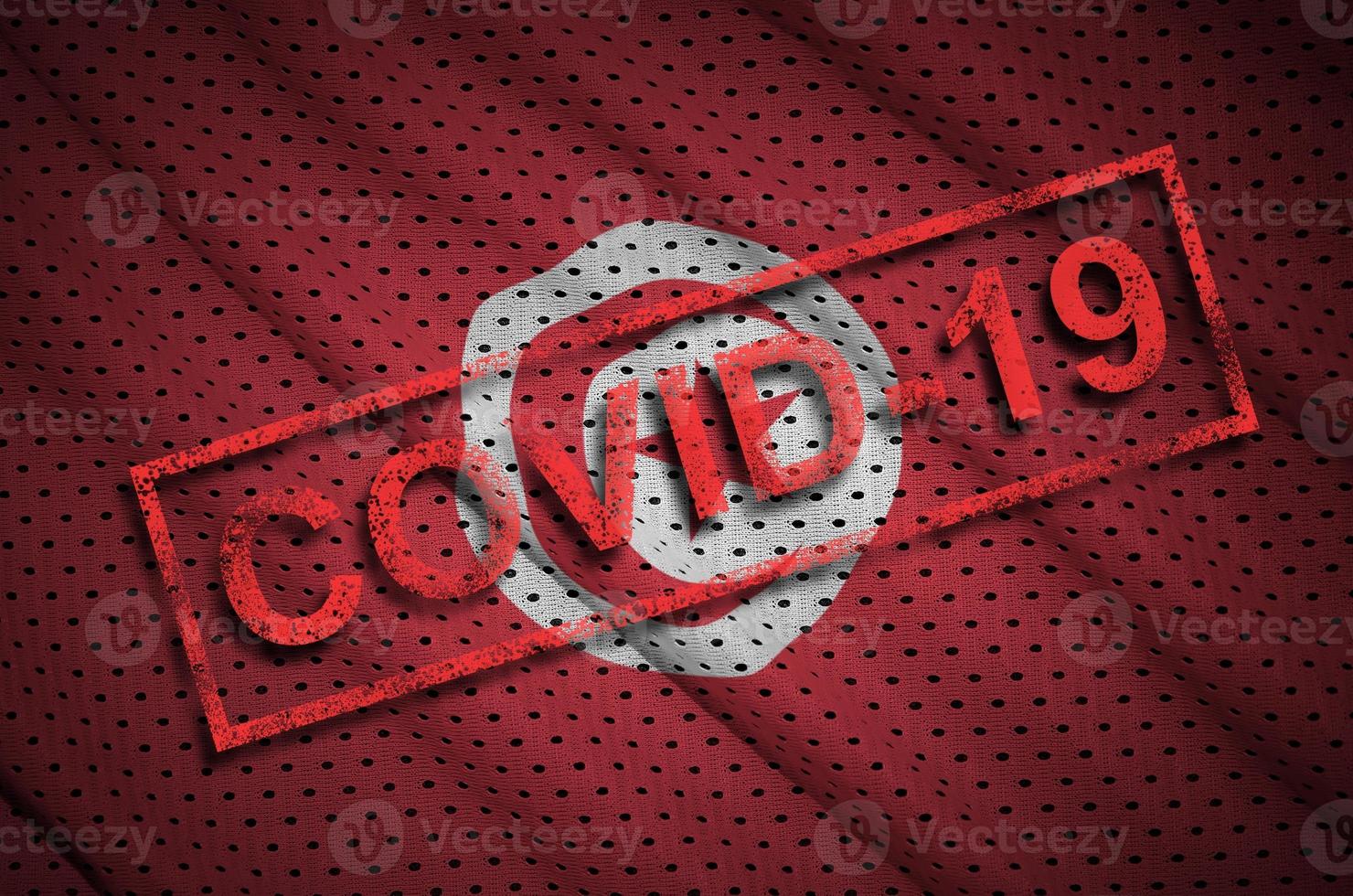 Tunisia flag and red Covid-19 stamp. Coronavirus 2019-nCov outbreak photo