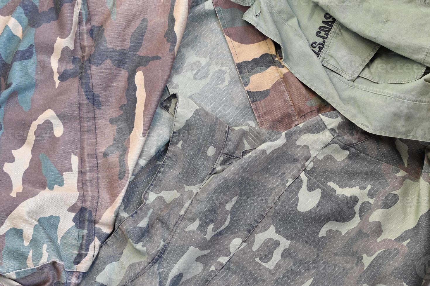 Camouflage background texture as backdrop for military service design projects photo