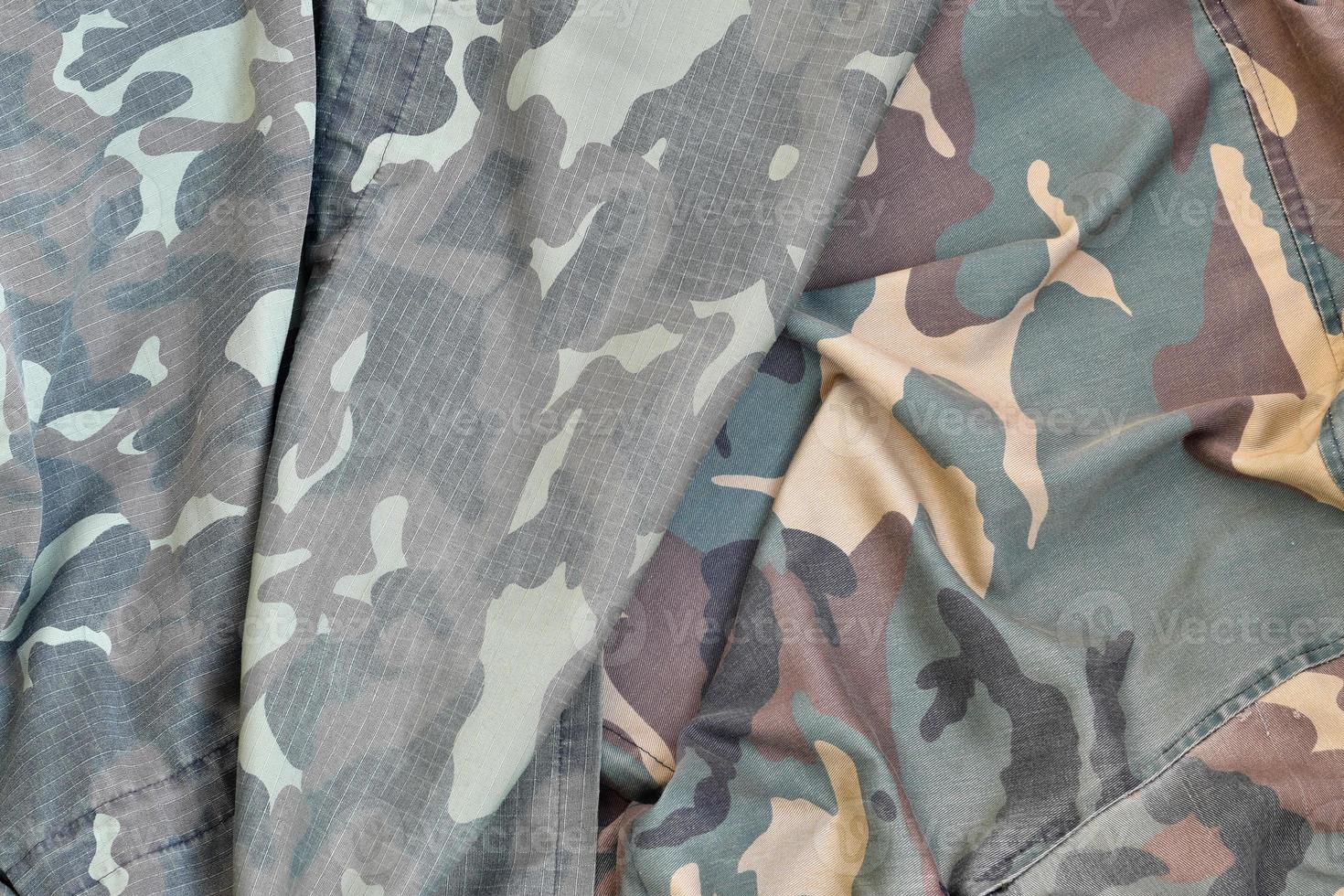 Camouflage background texture as backdrop for army and military design projects photo