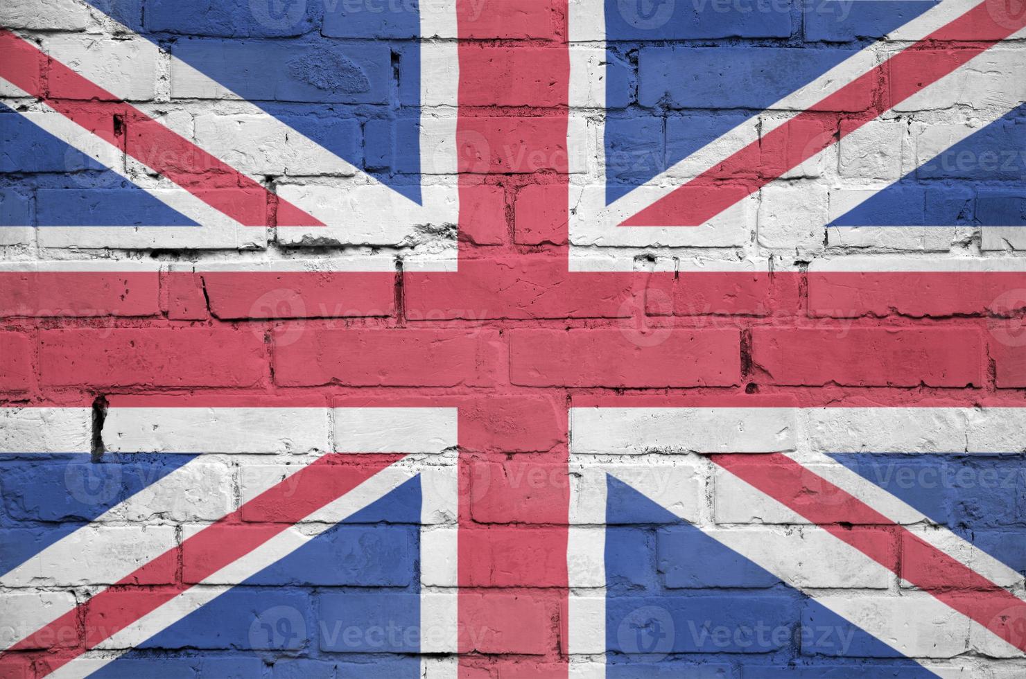 Great britain flag is painted onto an old brick wall photo